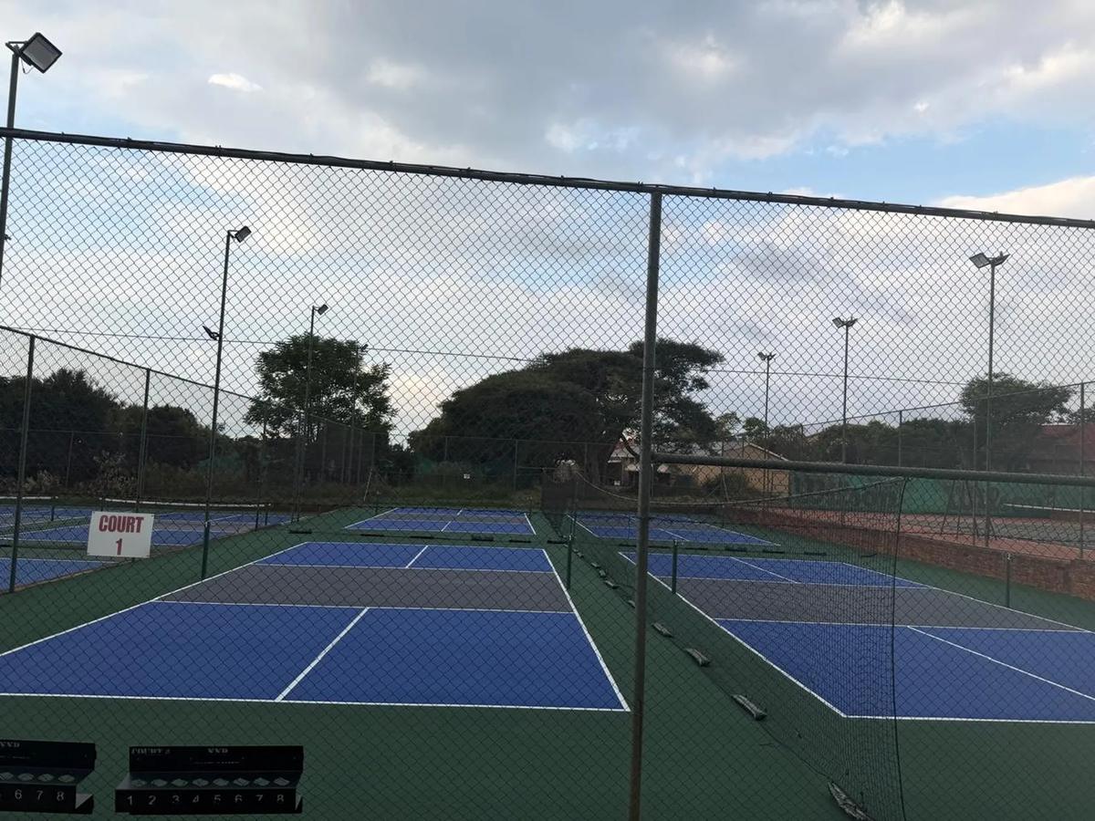 Club courts photographed at dusk