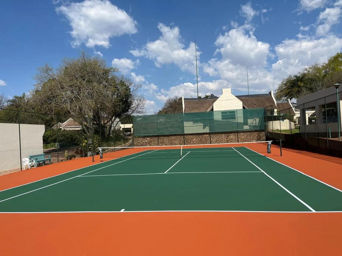 Classic green court with terracotta run-off