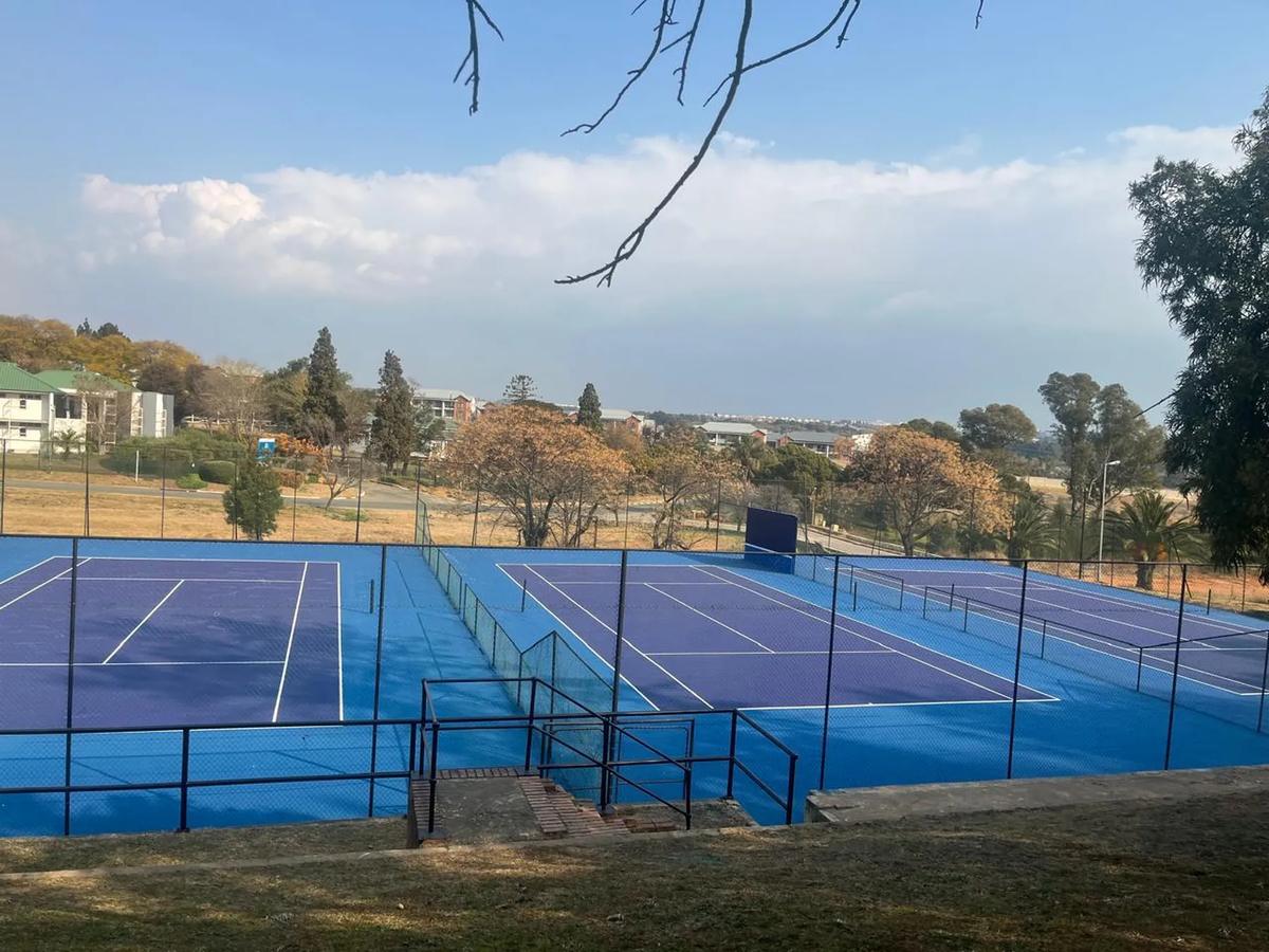 Twin acrylic tennis courts, club installation